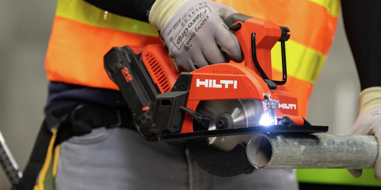 man using circular saw